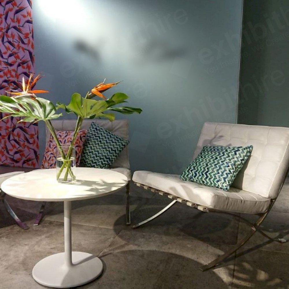 The Barcelona Chair has luxurious white leather material and is extremely comfortable.