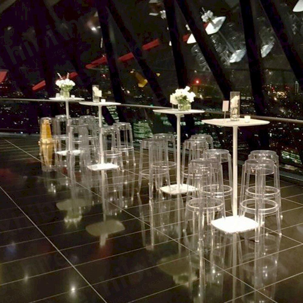This modern and classy setting includes our Soft Square Bar Tables and Charles Ghost Stools.
