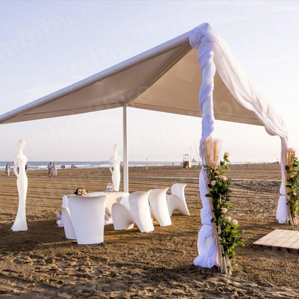 Our Tetra Pergola made an eye-catching and stylish structure at this beach event, paired with our Grace figure and Evie chairs.