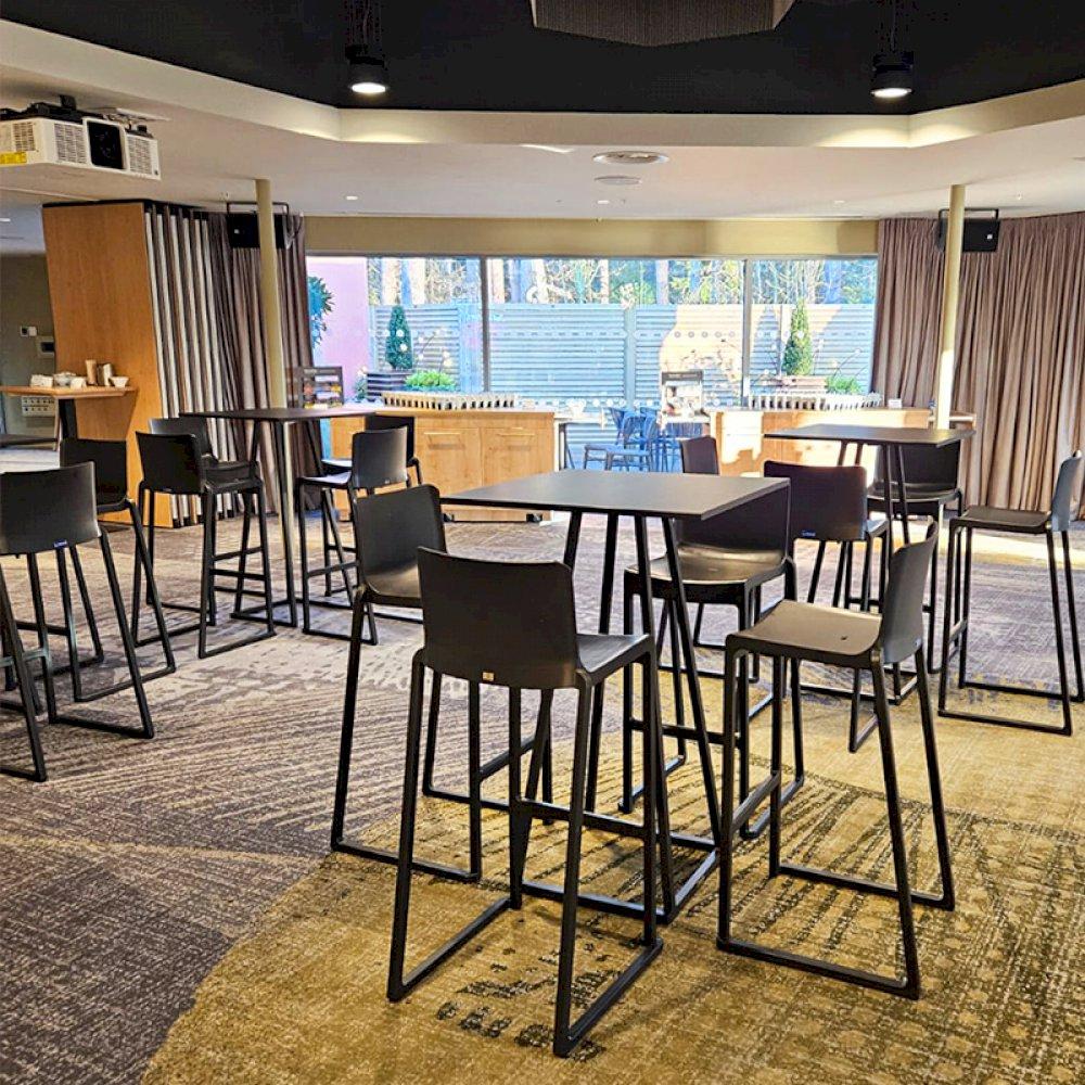 Add height in your Reception area with black Kansas stools and Dallas square tables.